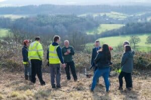 The Rt Hon Lord Benyon with the Surrey Hills Conservation Volunteers from Surrey Choices Growth team and Surrey Hills Society